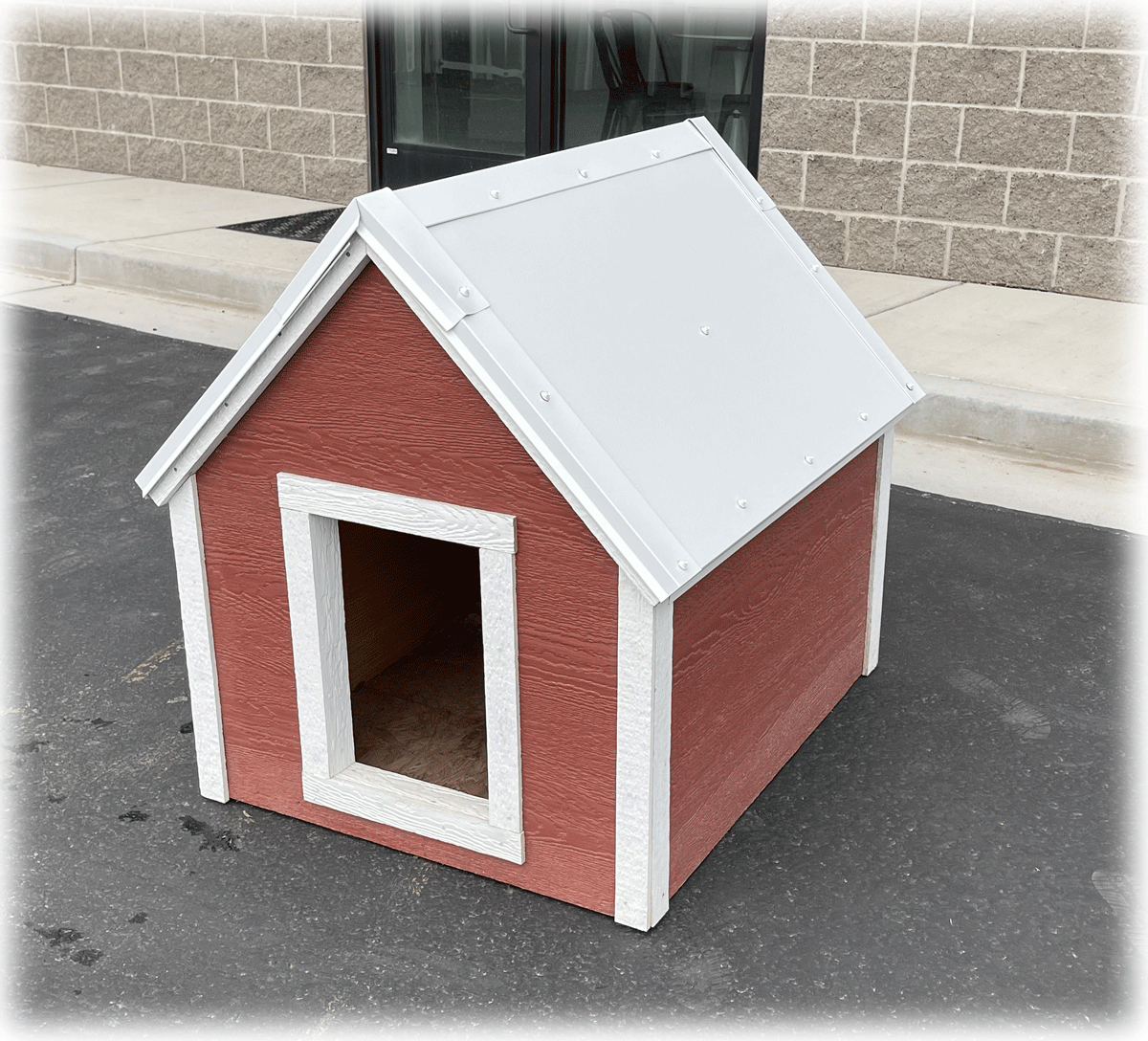 A Large red and white doghouse